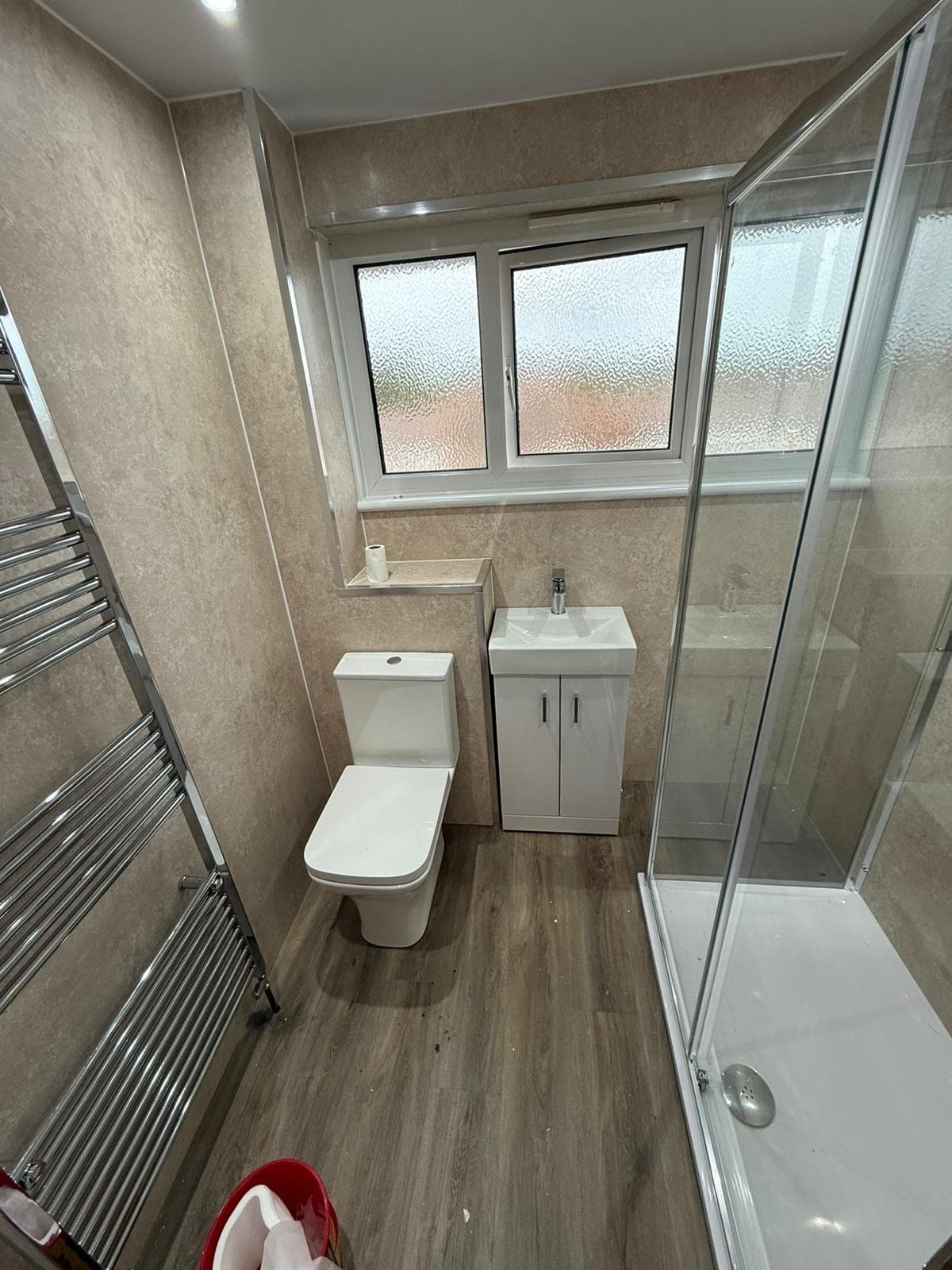 Bathroom with quadrant shower enclosure
