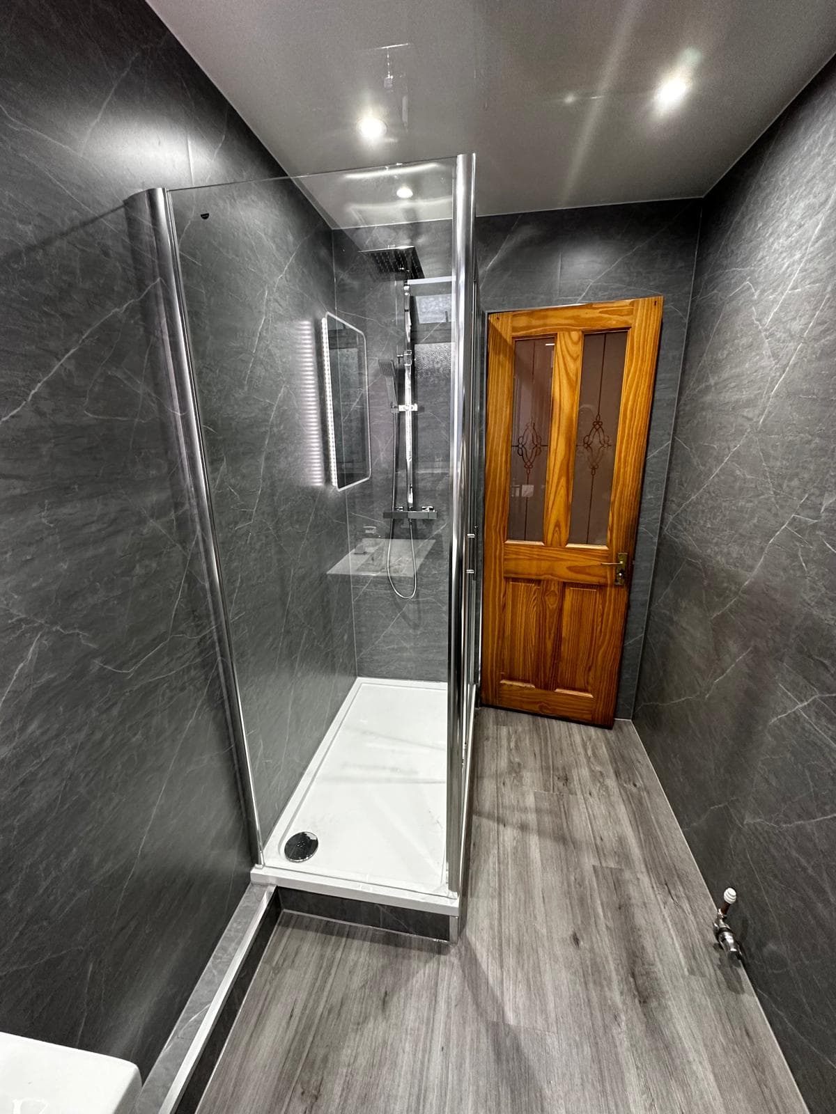 Dark grey marble shower room